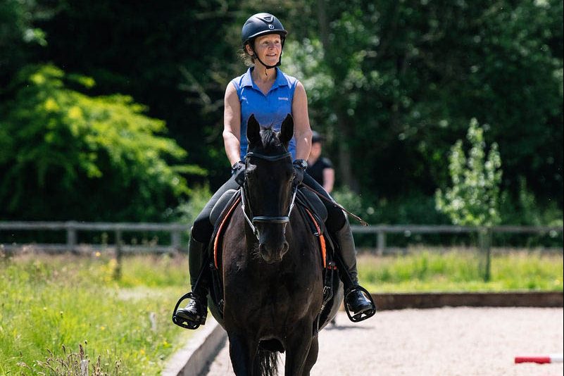 horse-rider-trotting-in-a-horse-arena