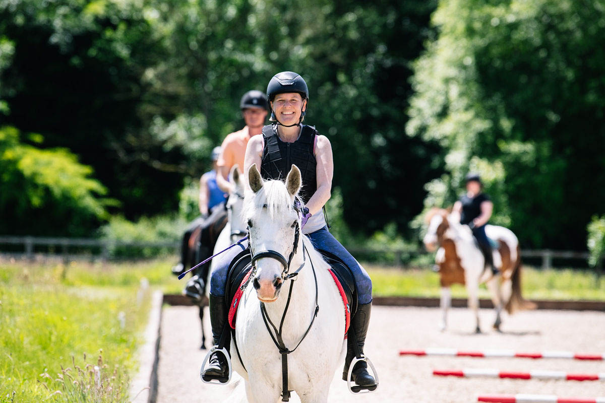 horse-riders-practicing-together-in-a-horse-riding-arena